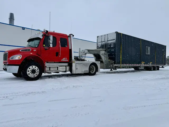 Freightliner M2 106 with lowboy